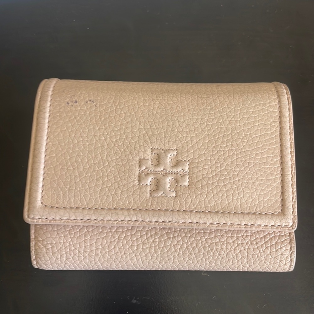 Tory Burch pale-pink tri-fold wallet.